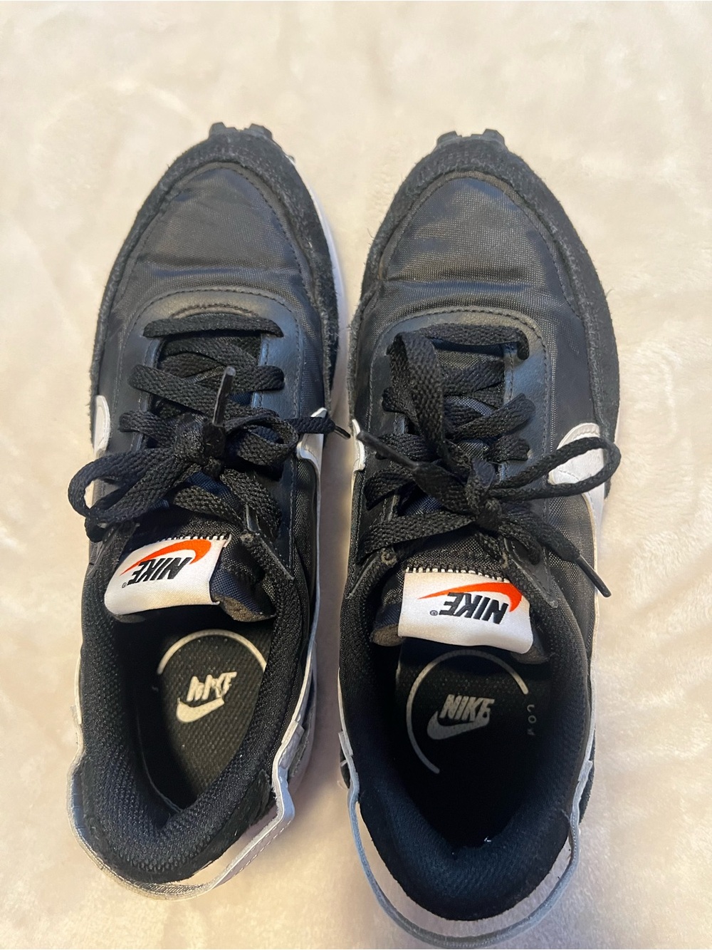 Womenβs Black & White Low-Top Sneakers with Orange Tongue Logo